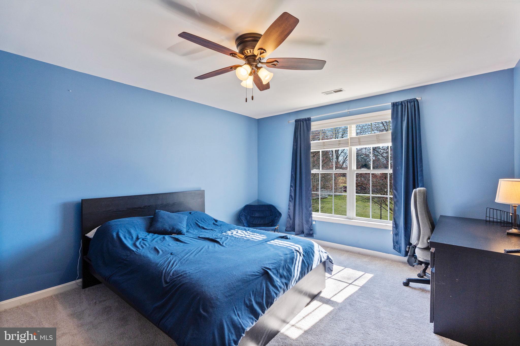 12298 Wake Forest Road Clarksville, MD 21029 - Photo 24 of 46 a bedroom with a bed and a large window