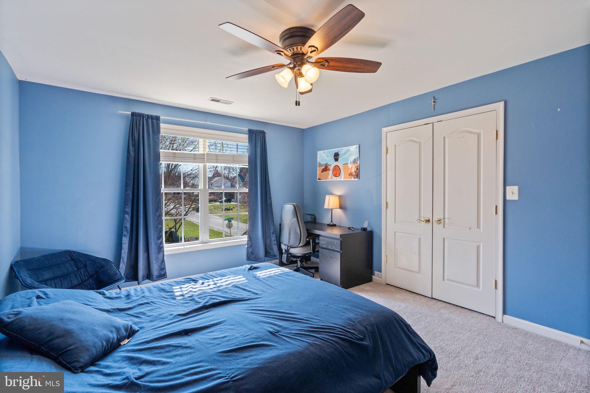 12298 Wake Forest Road Clarksville, MD 21029 - Photo 25 of 46 a bedroom with a large bed and a window