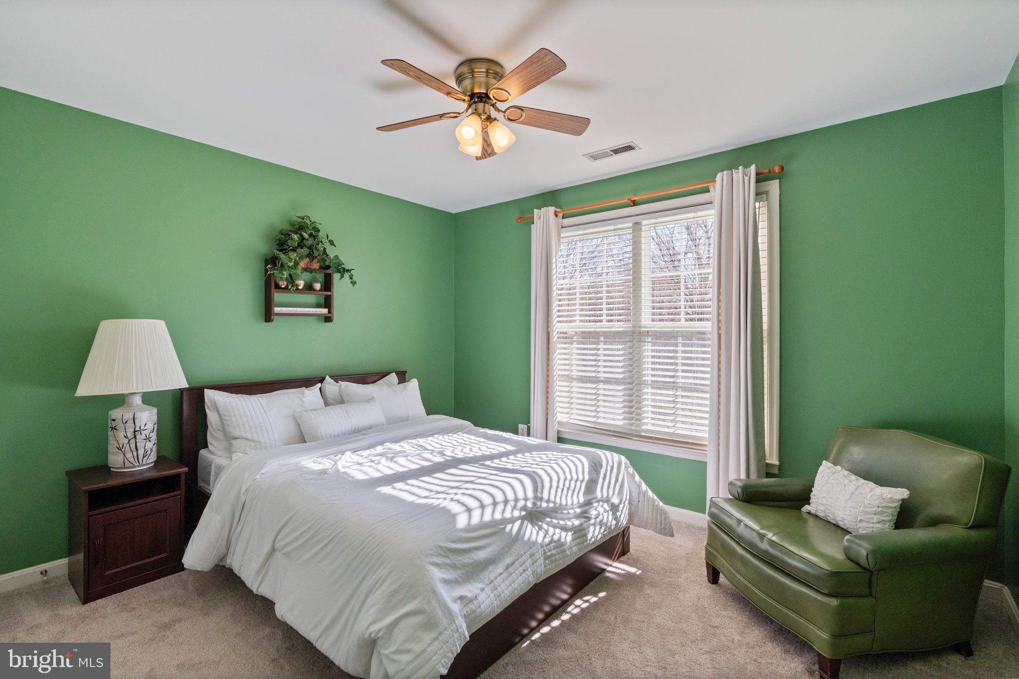 12298 Wake Forest Road Clarksville, MD 21029 - Photo 28 of 46 a bedroom with a bed and a couch