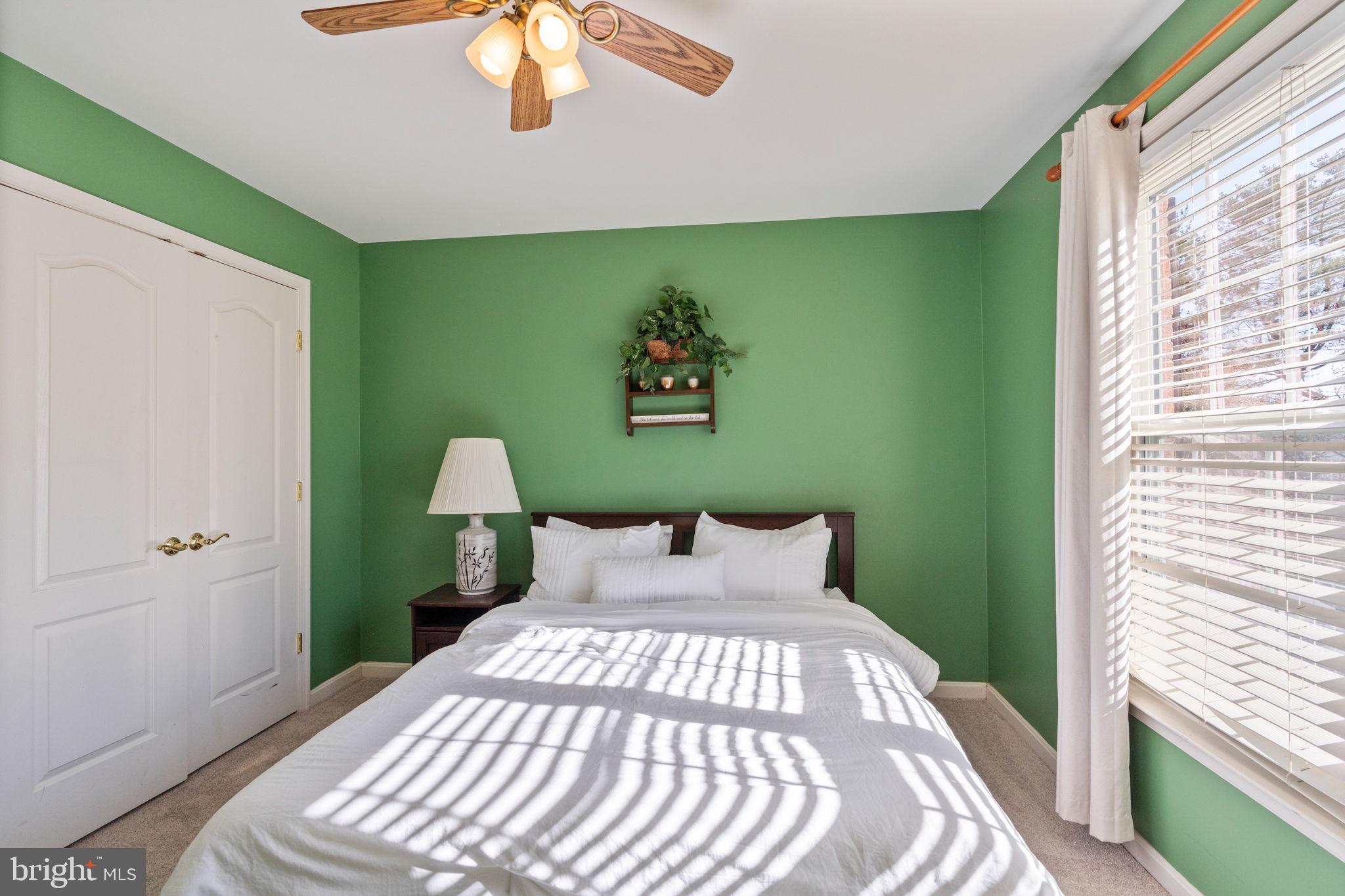 12298 Wake Forest Road Clarksville, MD 21029 - Photo 29 of 46 a bedroom with a bed and a window