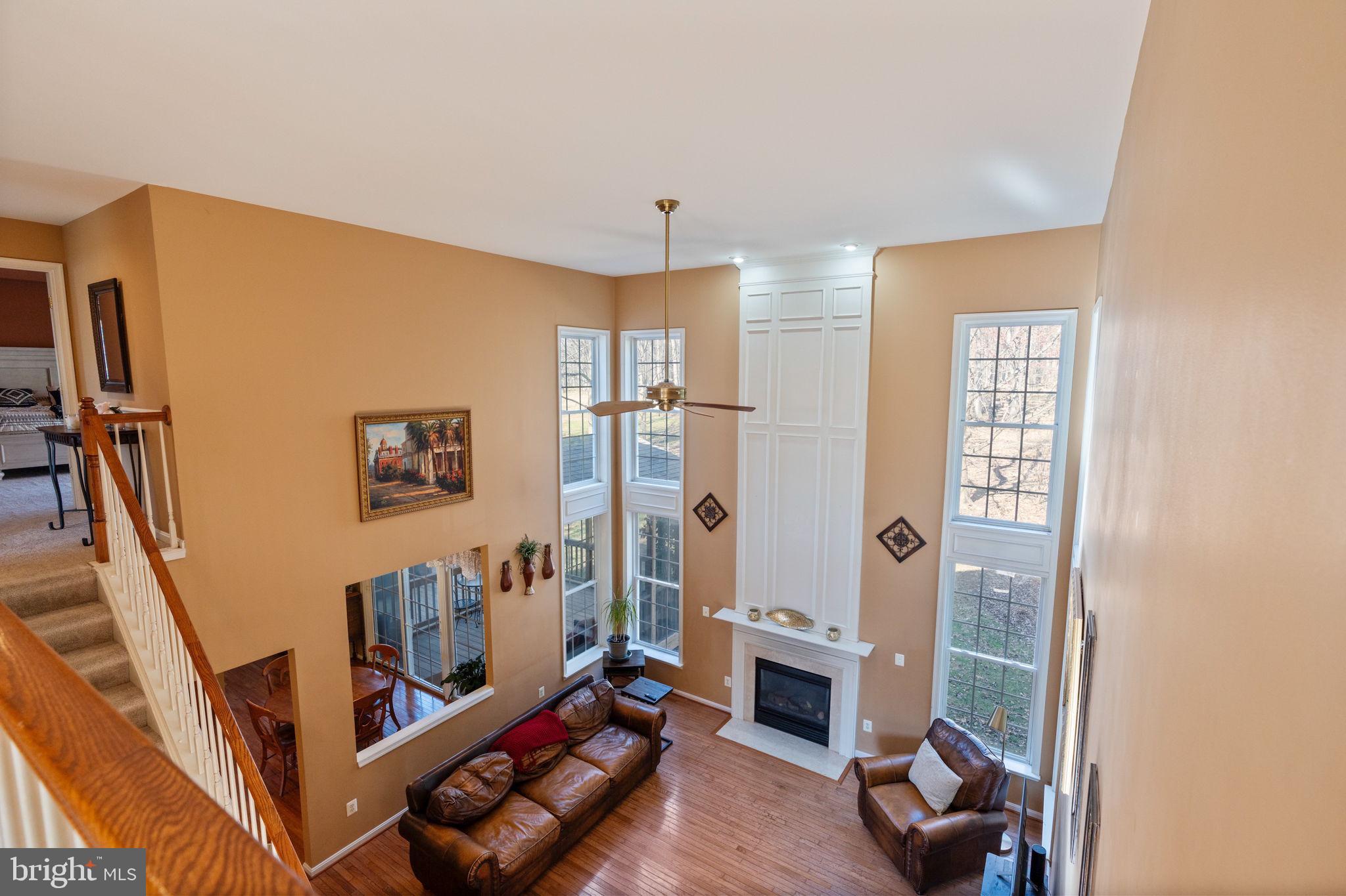 12298 Wake Forest Road Clarksville, MD 21029 - Photo 34 of 46 a living room with furniture and a wooden floor