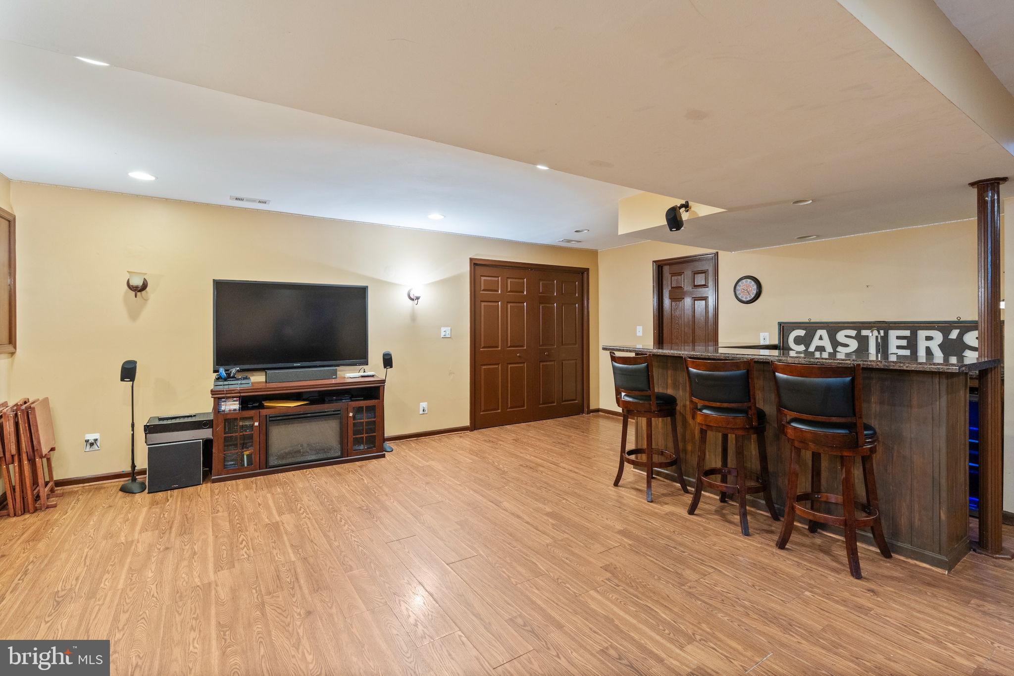 12298 Wake Forest Road Clarksville, MD 21029 - Photo 36 of 46 a bedroom with furniture and a flat screen tv