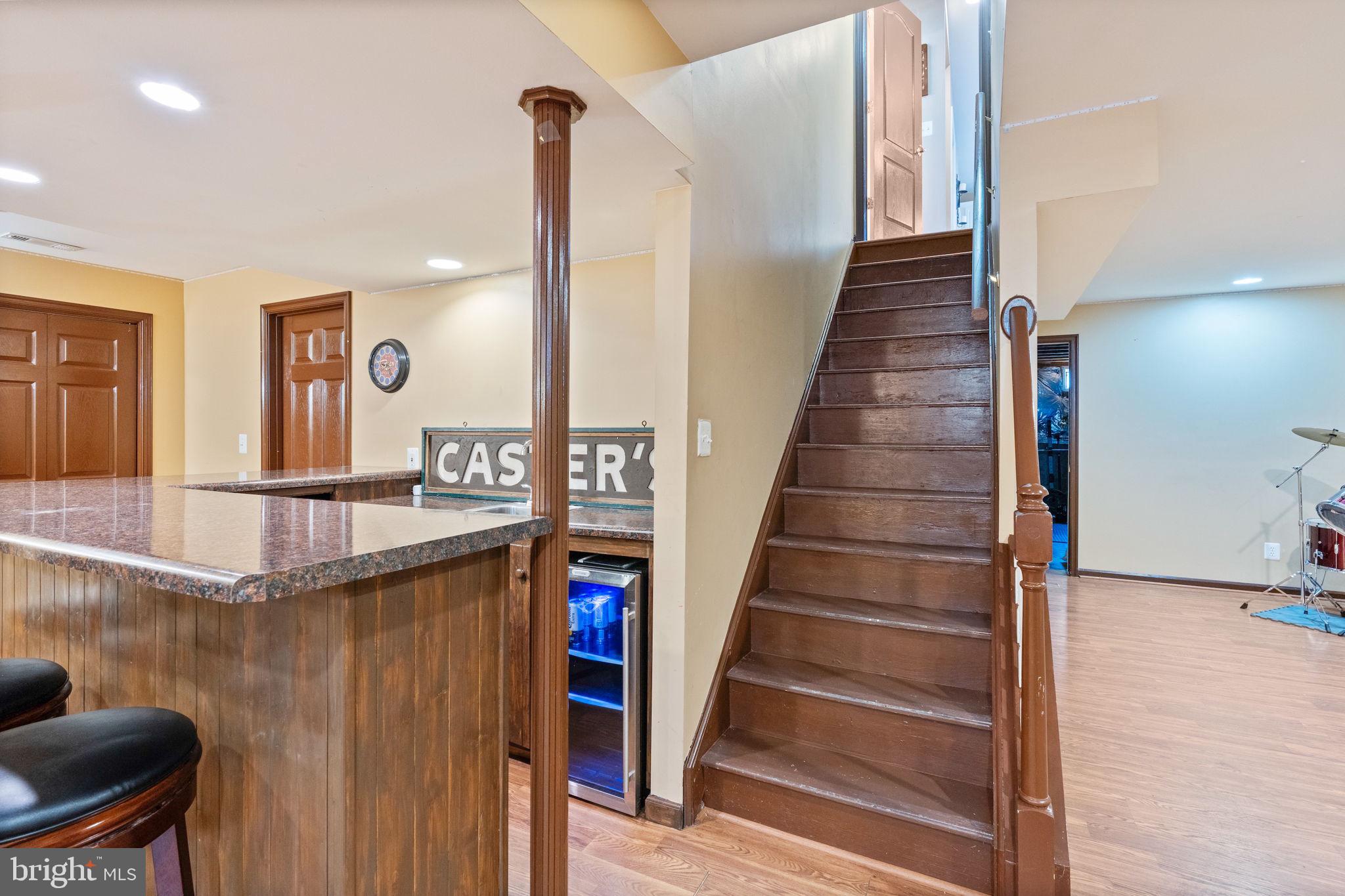 12298 Wake Forest Road Clarksville, MD 21029 - Photo 38 of 46 a view of entryway and hall with wooden floor