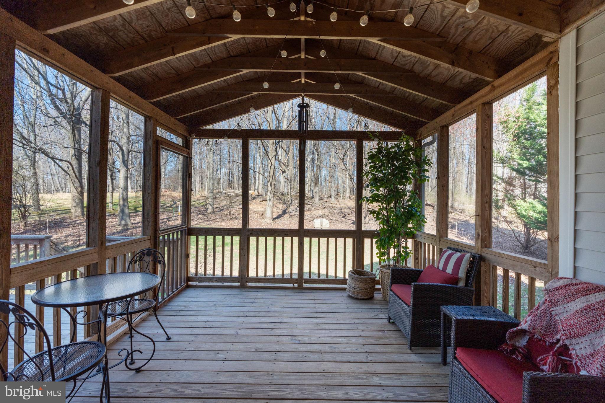 12298 Wake Forest Road Clarksville, MD 21029 - Photo 41 of 46 a roof deck with couches and wooden floor