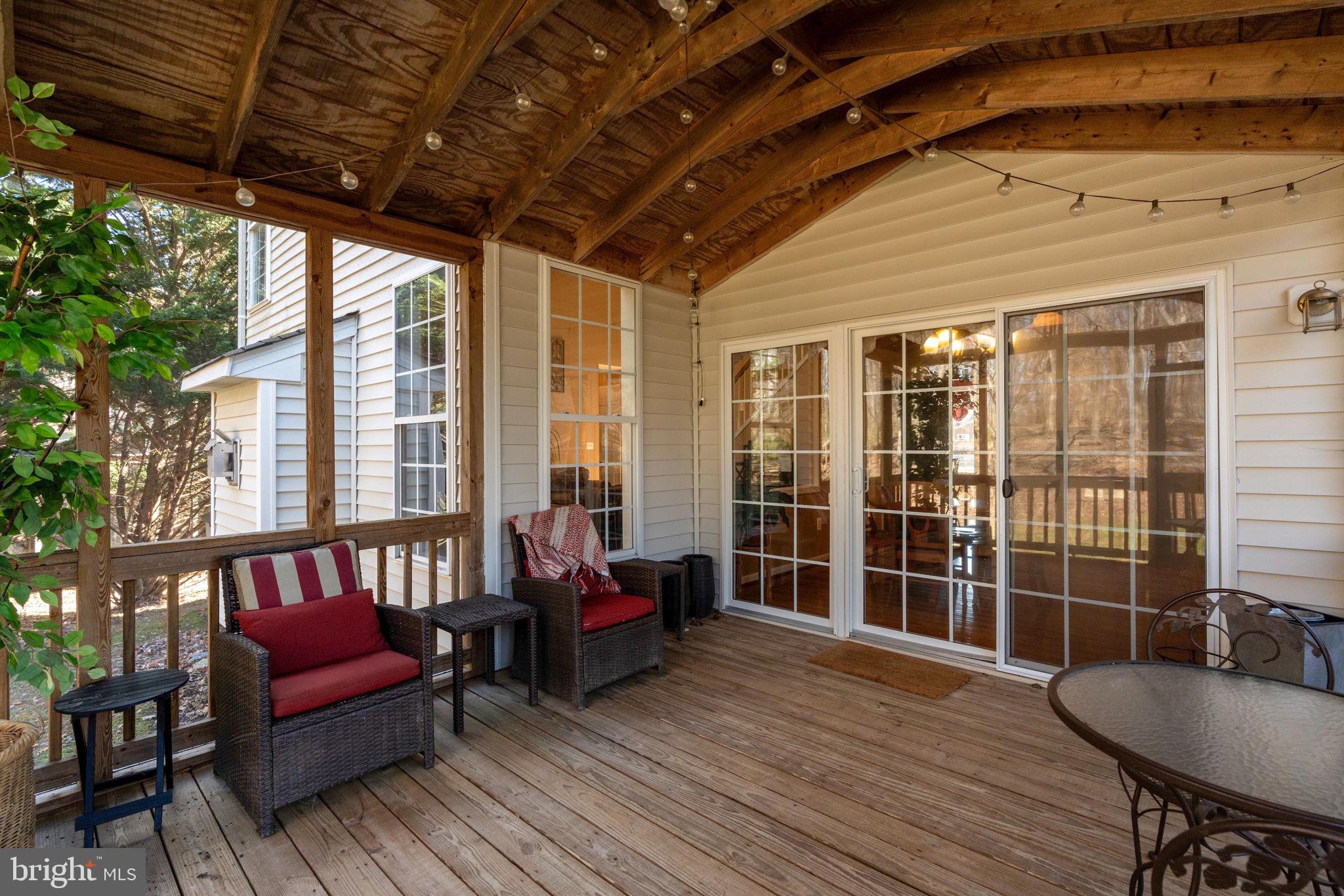 12298 Wake Forest Road Clarksville, MD 21029 - Photo 42 of 46 a balcony with furniture and wooden floor