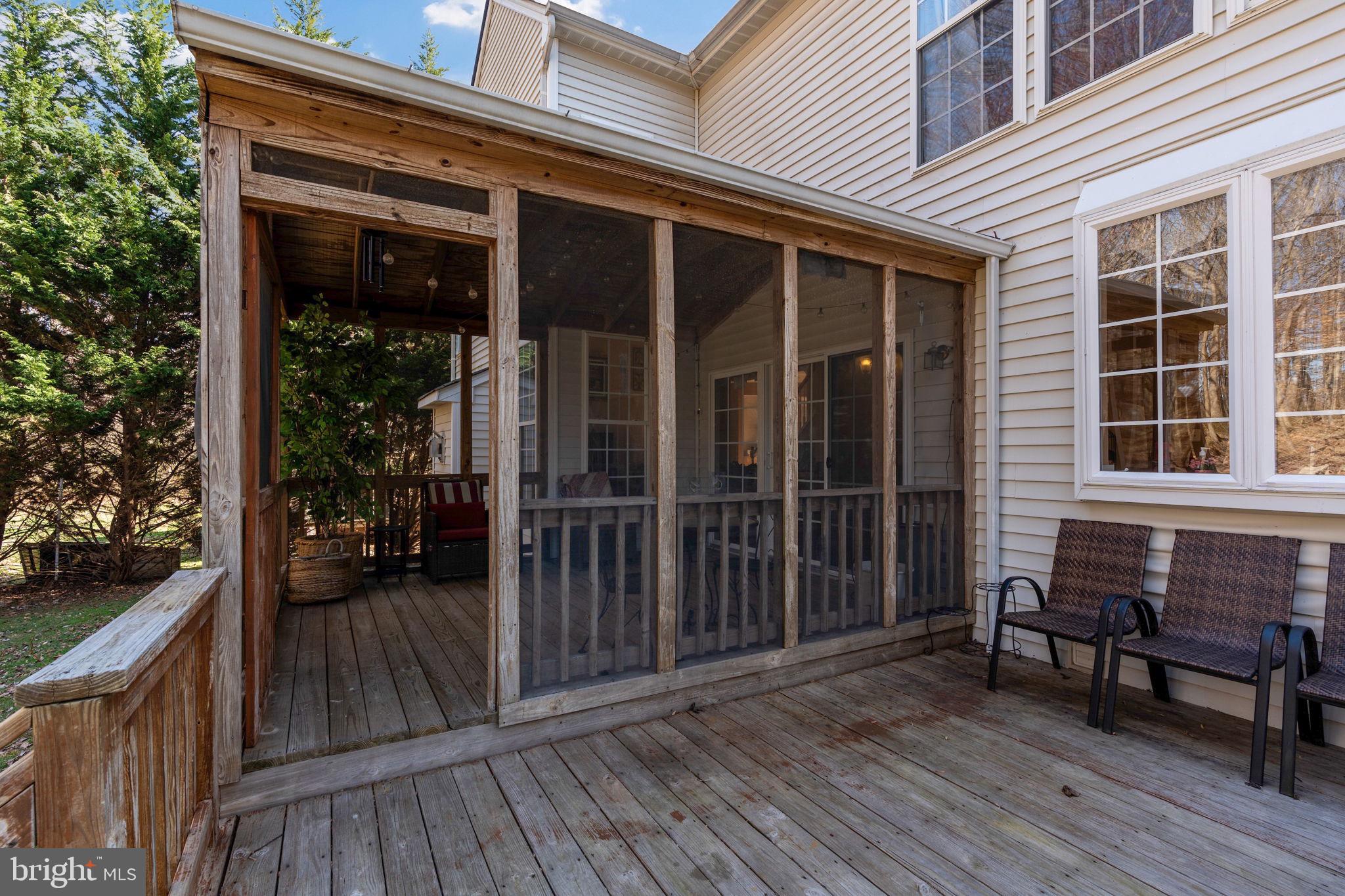 12298 Wake Forest Road Clarksville, MD 21029 - Photo 43 of 46 a view of house with deck outdoor seating and wooden floor