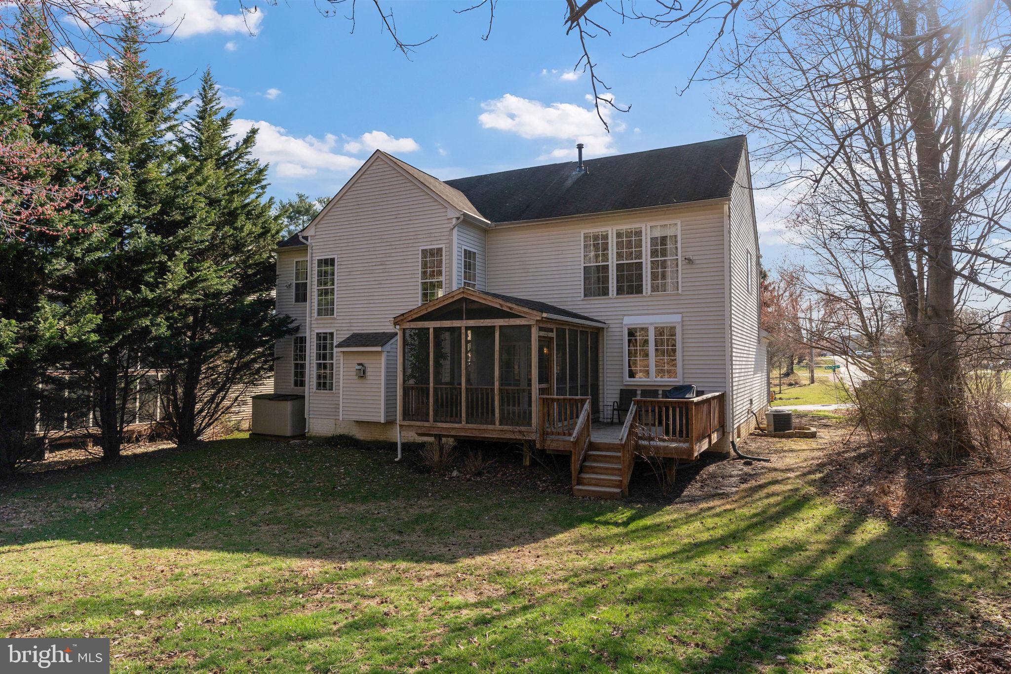 12298 Wake Forest Road Clarksville, MD 21029 - Photo 44 of 46 a view of a house with a yard porch and wooden fence