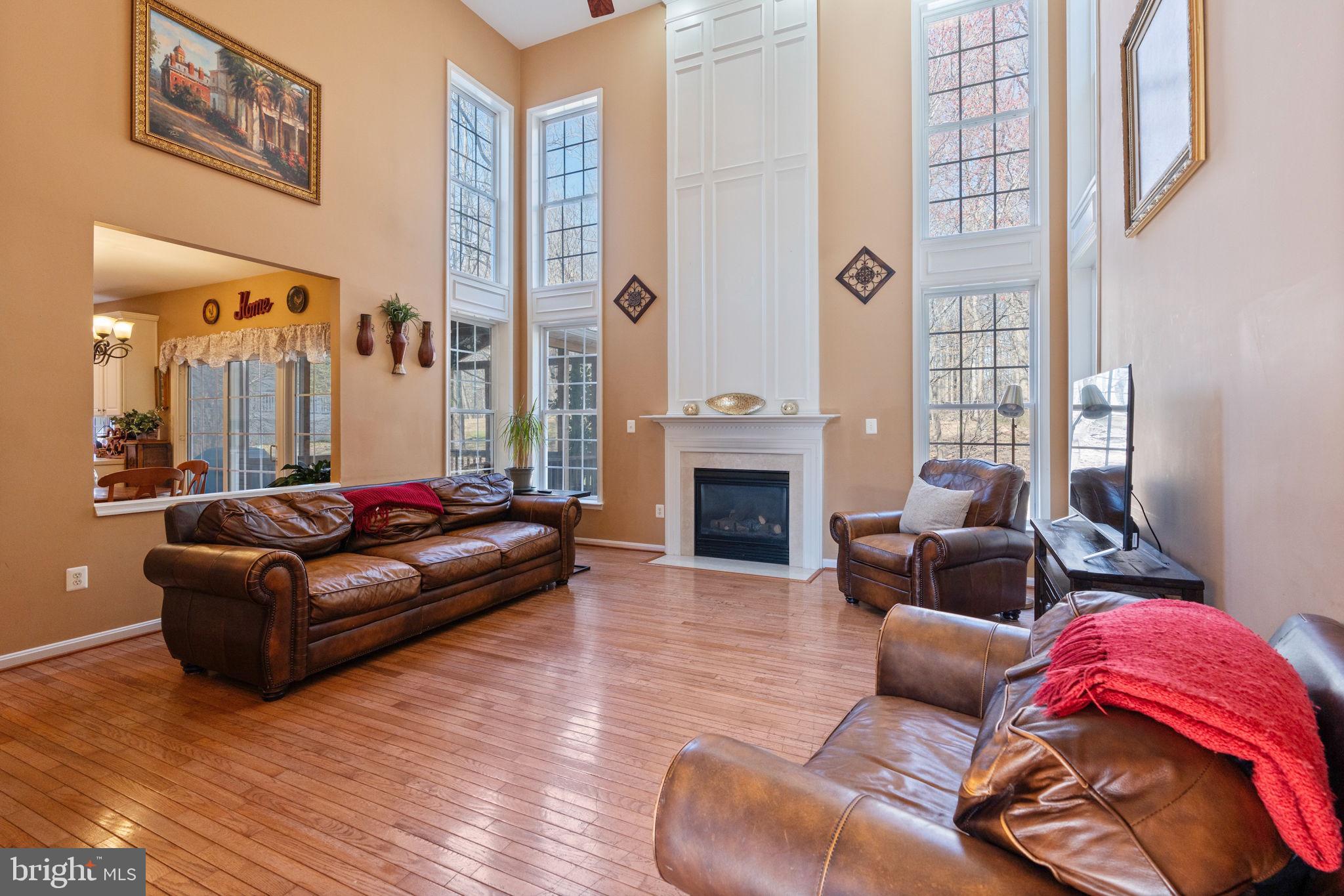 12298 Wake Forest Road Clarksville, MD 21029 - Photo 6 of 46 a living room with furniture and a fireplace