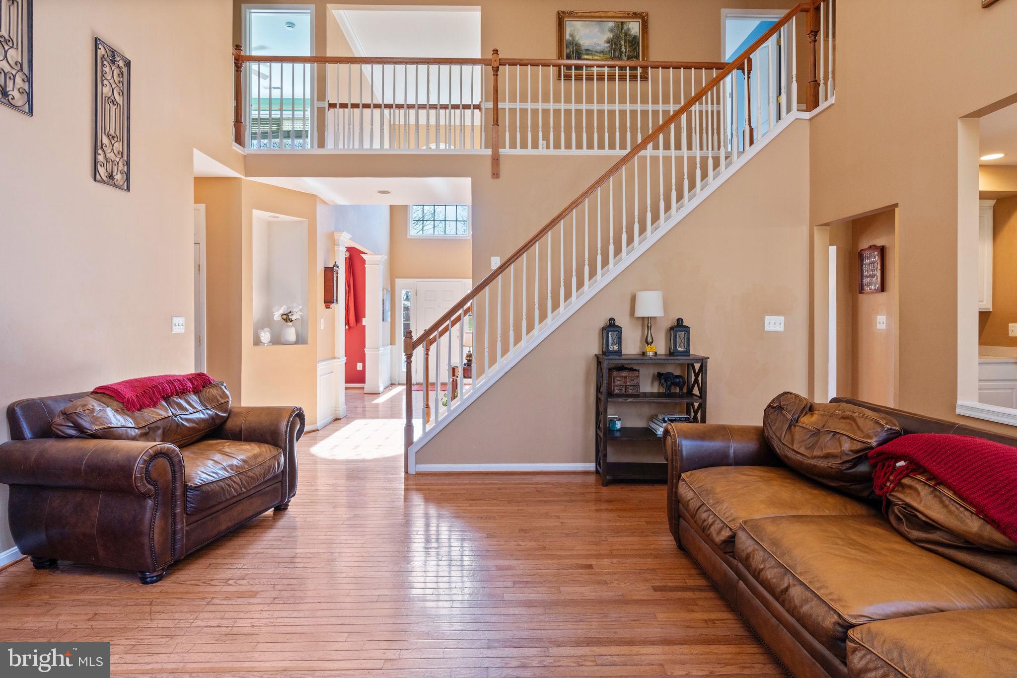 12298 Wake Forest Road Clarksville, MD 21029 - Photo 7 of 46 a living room with furniture and stairs