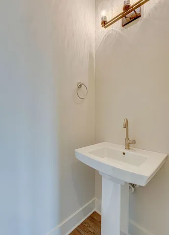 a view of balcony with wooden floor and fence