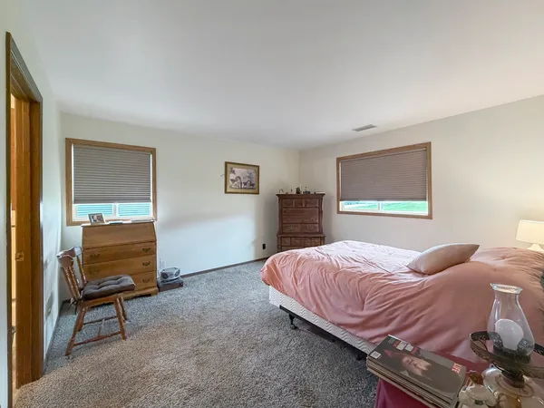 a bedroom with a bed and a cabinets