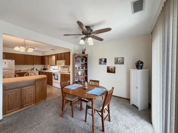 a dining room with furniture and window