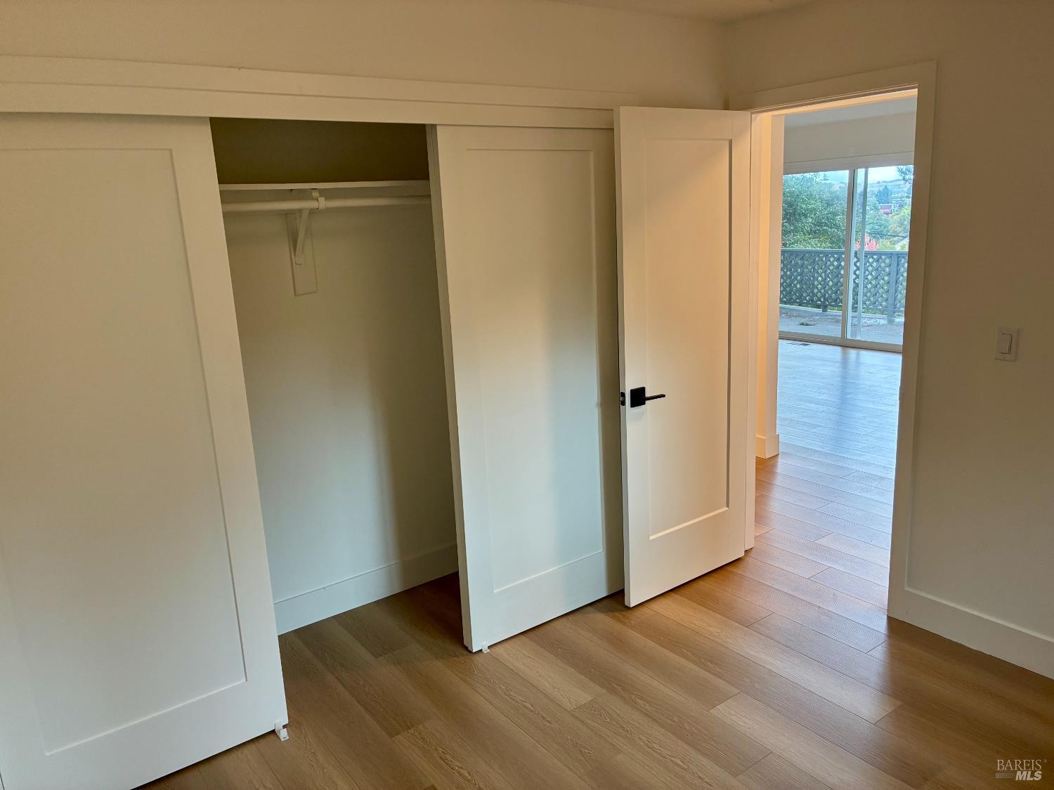 239 Corte Madera Avenue Corte Madera, CA 94925 - Photo 13 of 21 an empty room with wooden floor and closet