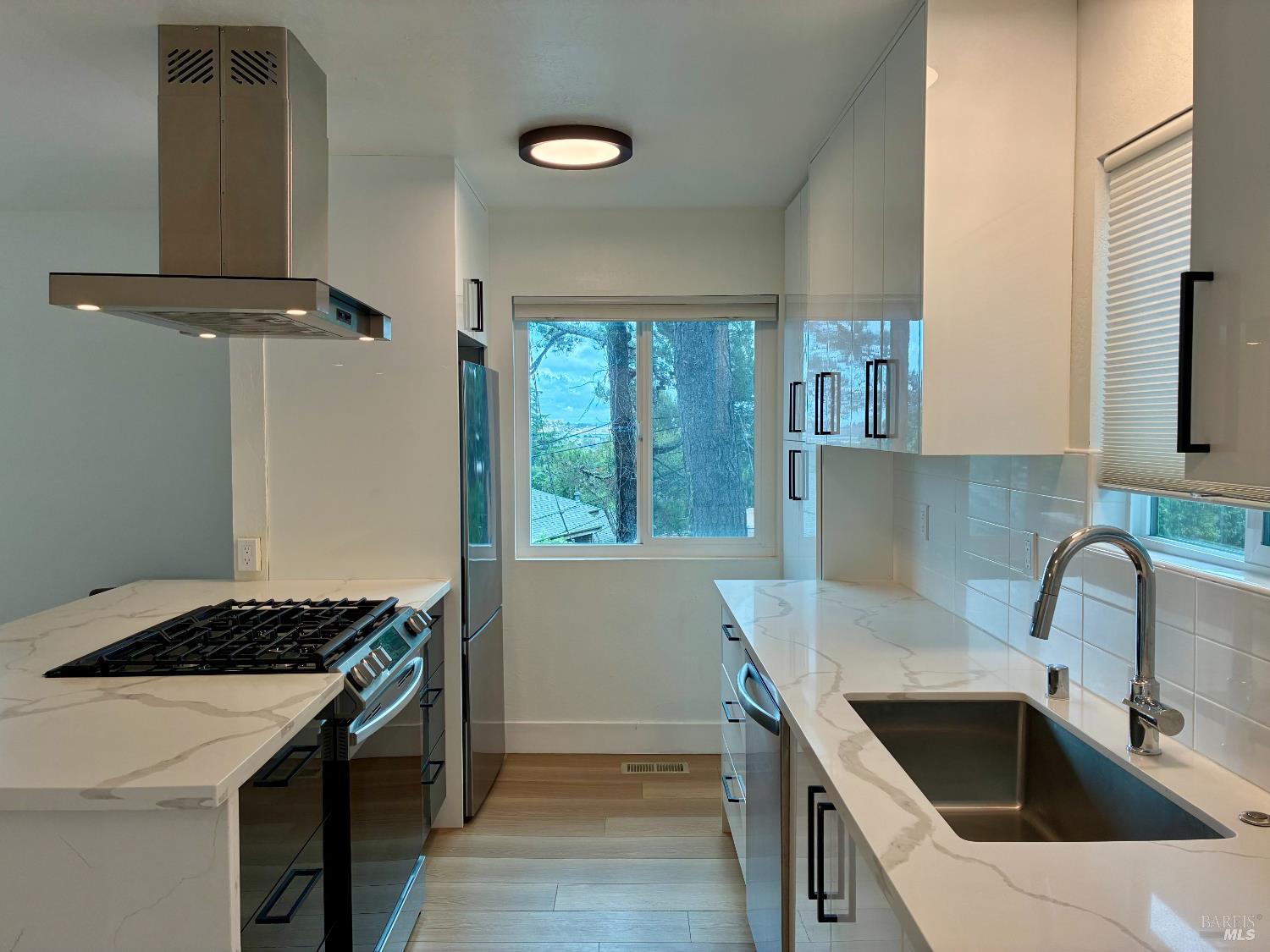 239 Corte Madera Avenue Corte Madera, CA 94925 - Photo 2 of 21 a kitchen that has a sink and a stove