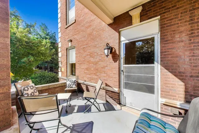 a view of backyard with outdoor seating and plants