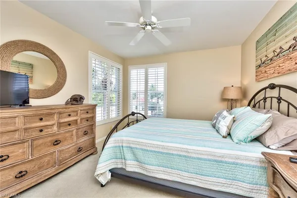 a bedroom with bed and window