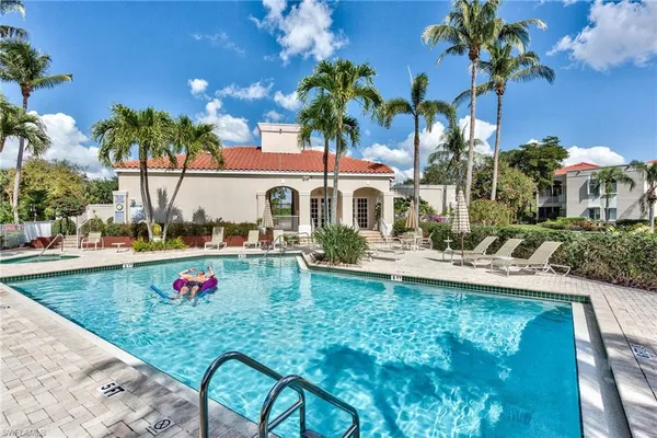 a view of a backyard with a tub and potted plants