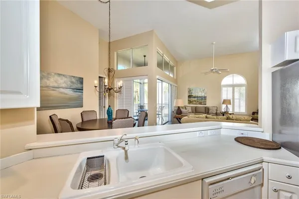 a view of living room with granite countertop furniture and a fireplace