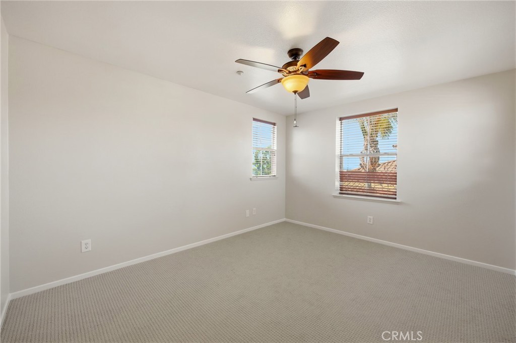 3603 Jetty Carlsbad, CA 92010 - Photo 28 of 43 an empty room with windows and fan
