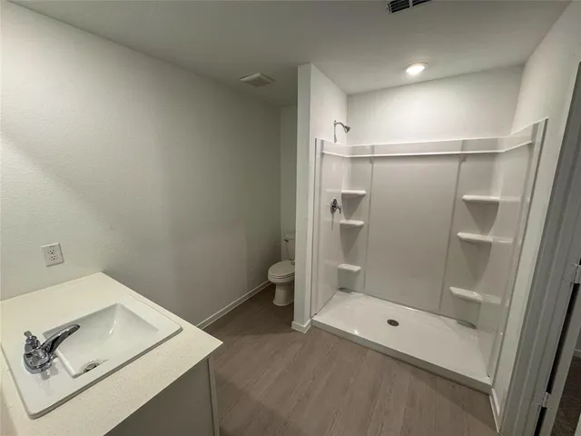 a bathroom with a bath tub and a shower