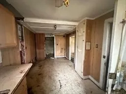 a view of a hallway with a bathroom