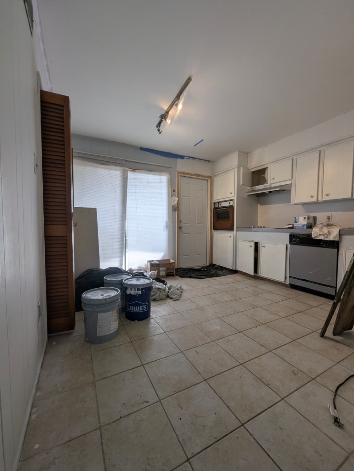 7209 Beechnut Street, Unit A Houston, TX 77074 - Photo 3 of 7 a kitchen with a sink and white cabinets