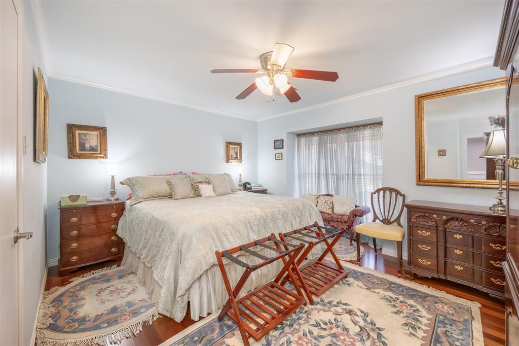 15615 Preston Road, Unit 1010 Dallas, TX 75248 - Photo 30 of 40 Bedroom 2, Brazilian Cherry engineered floors, ceiling fan/light, large walk-in closet and crown molding.