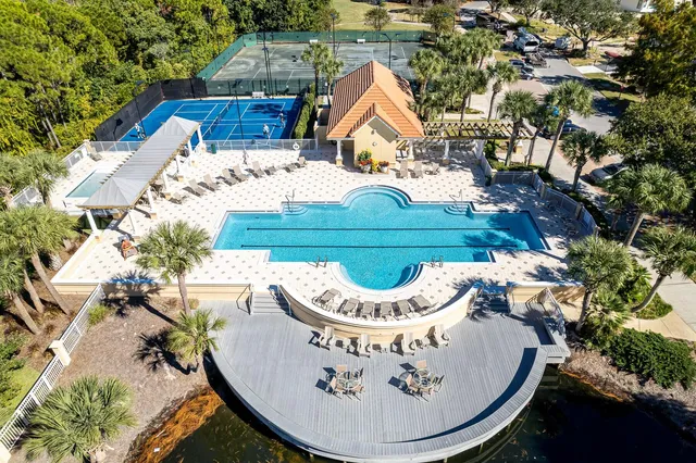 an outdoor sitting area with furniture