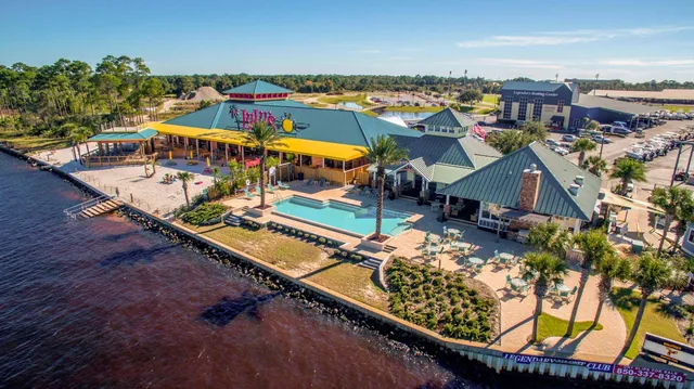 an aerial view of a house with a ocean view