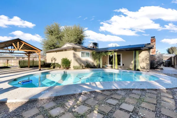 a view of a house with swimming pool