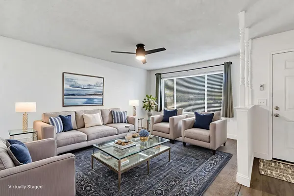 a living room with furniture and a large window