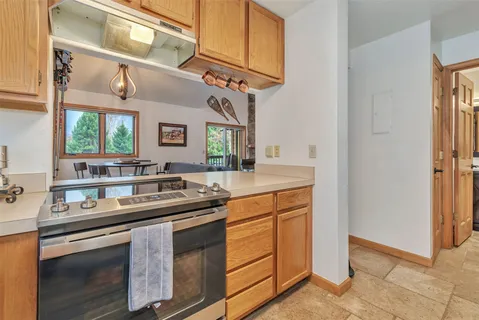 a kitchen with stainless steel appliances granite countertop a sink and cabinets