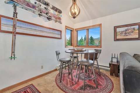 a view of a dining room with furniture window and outside view