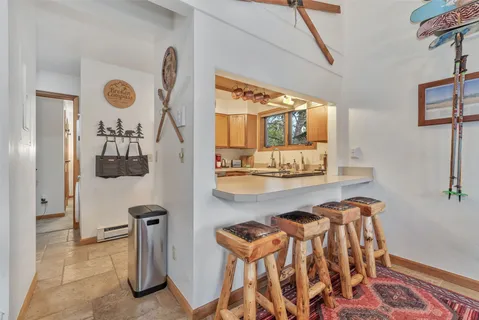a view of a room with furniture and wooden floor