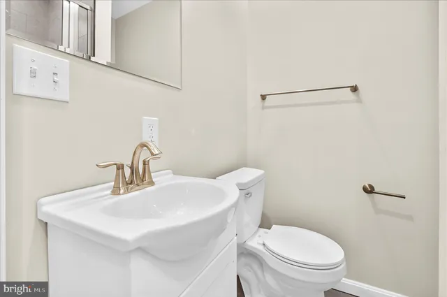a bathroom with a granite countertop shower