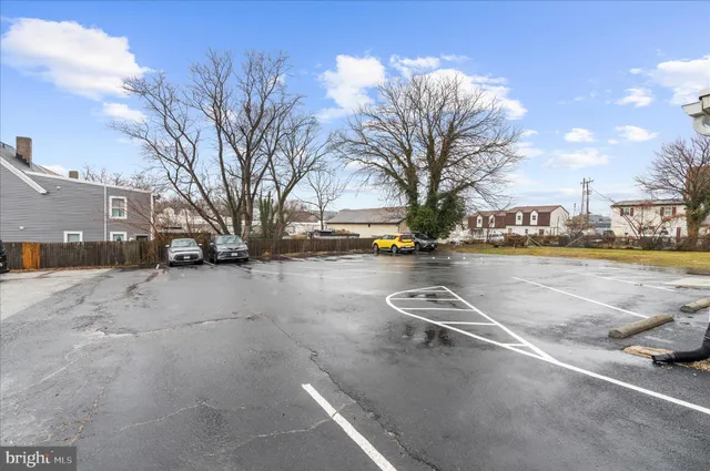a view of street with parked cars