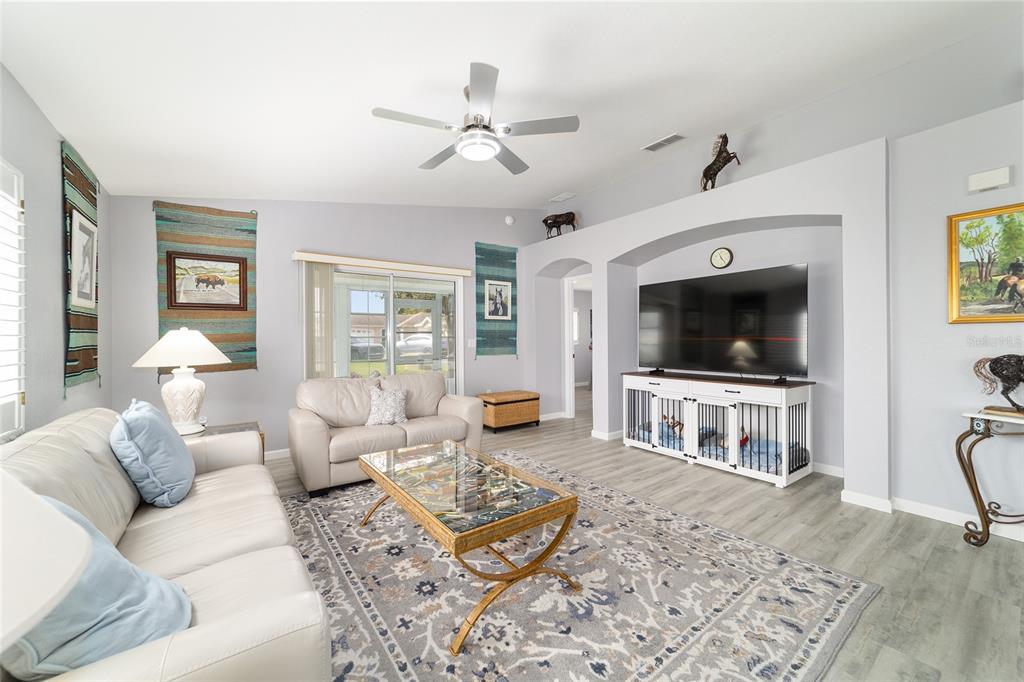 8608 Southeast 141st Street Road Summerfield, FL 34491 - Photo 14 of 82 a living room with furniture and a flat screen tv