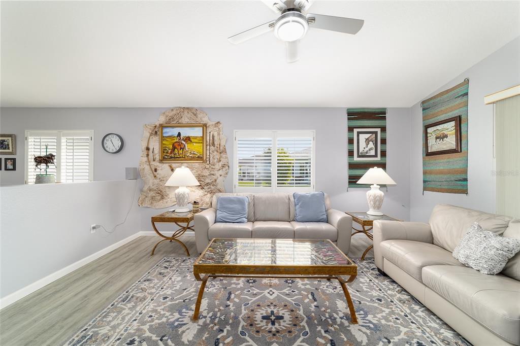 8608 Southeast 141st Street Road Summerfield, FL 34491 - Photo 15 of 82 a living room with furniture and a large window