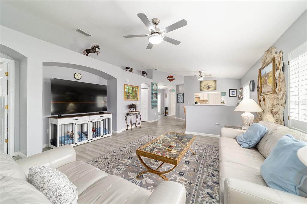 8608 Southeast 141st Street Road Summerfield, FL 34491 - Photo 18 of 82 a living room with furniture and a flat screen tv