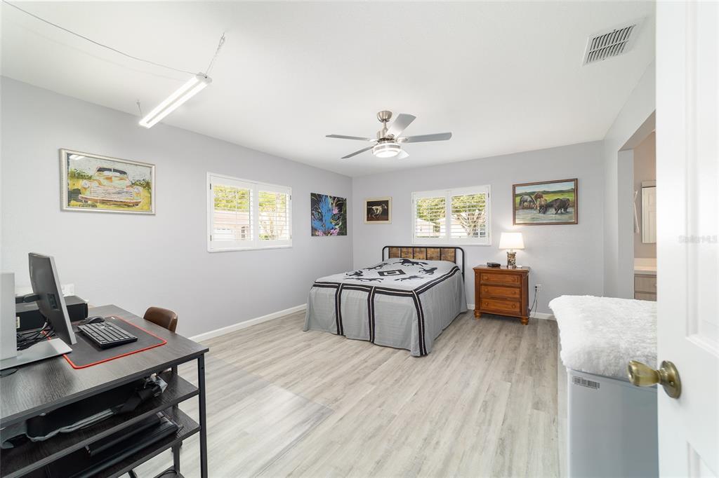 8608 Southeast 141st Street Road Summerfield, FL 34491 - Photo 26 of 82 a view of a workspace with furniture and a window