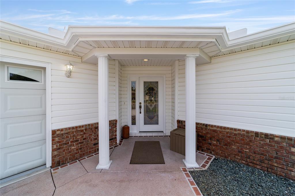 8608 Southeast 141st Street Road Summerfield, FL 34491 - Photo 3 of 82 a view of entrance door of the house