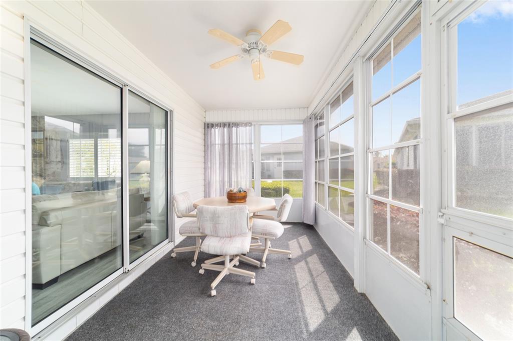 8608 Southeast 141st Street Road Summerfield, FL 34491 - Photo 43 of 82 a living room with furniture and a large window