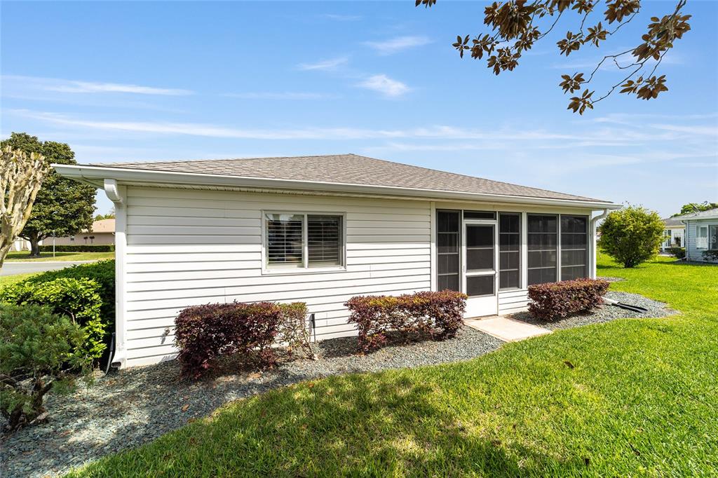 8608 Southeast 141st Street Road Summerfield, FL 34491 - Photo 45 of 82 a house view with a garden space