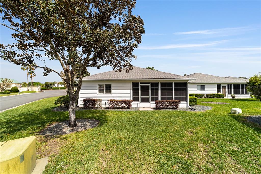 8608 Southeast 141st Street Road Summerfield, FL 34491 - Photo 47 of 82 a view of a house with a yard porch and sitting area