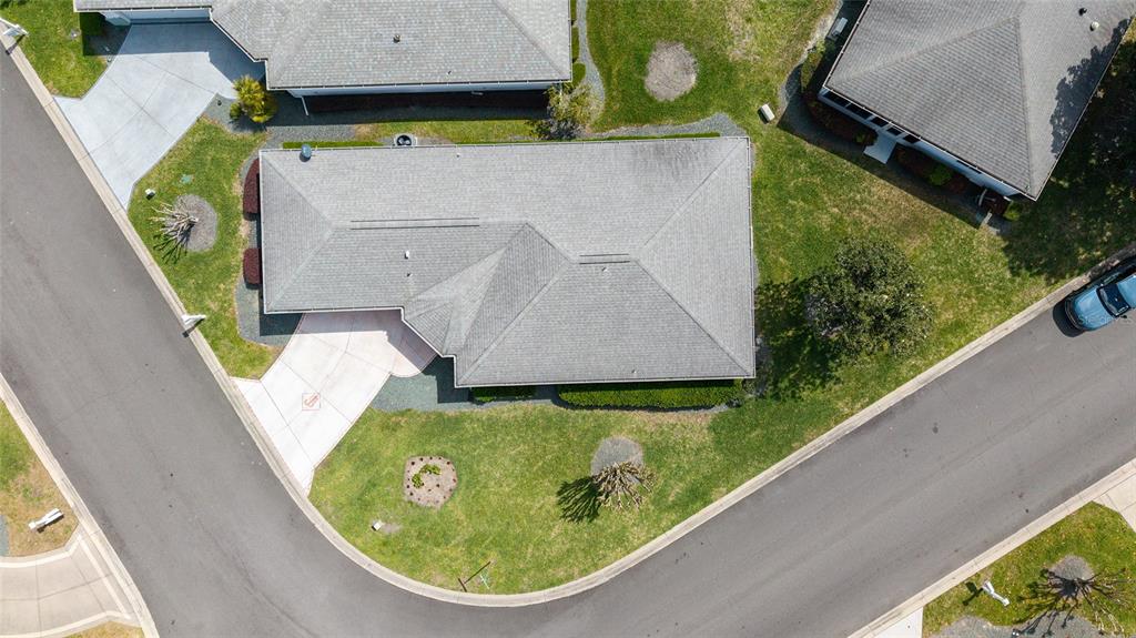 8608 Southeast 141st Street Road Summerfield, FL 34491 - Photo 52 of 82 an aerial view of a house with garden space and swimming pool