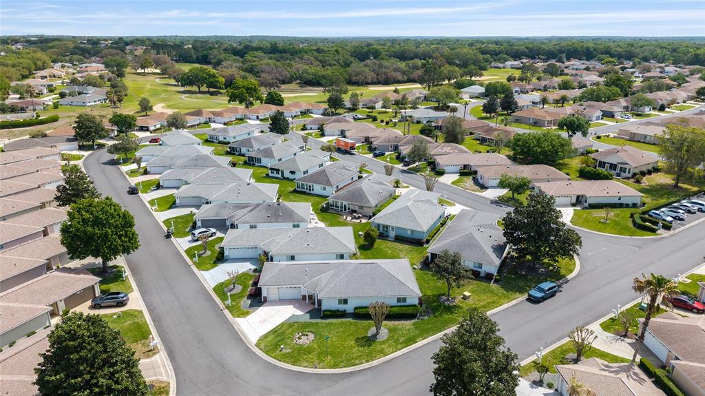 8608 Southeast 141st Street Road Summerfield, FL 34491 - Photo 56 of 82 an aerial view of residential houses with outdoor space and swimming pool