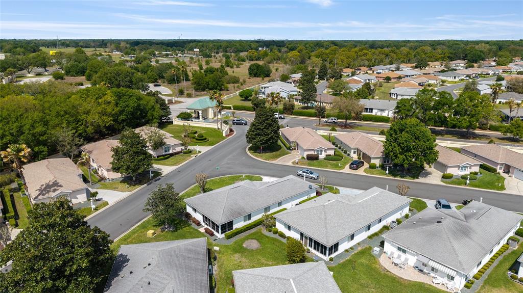 8608 Southeast 141st Street Road Summerfield, FL 34491 - Photo 57 of 82 an aerial view of multiple houses with yard