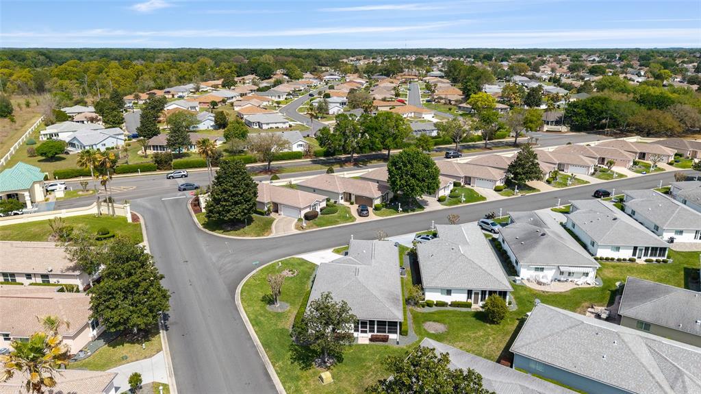 8608 Southeast 141st Street Road Summerfield, FL 34491 - Photo 58 of 82 an aerial view of a house with a garden