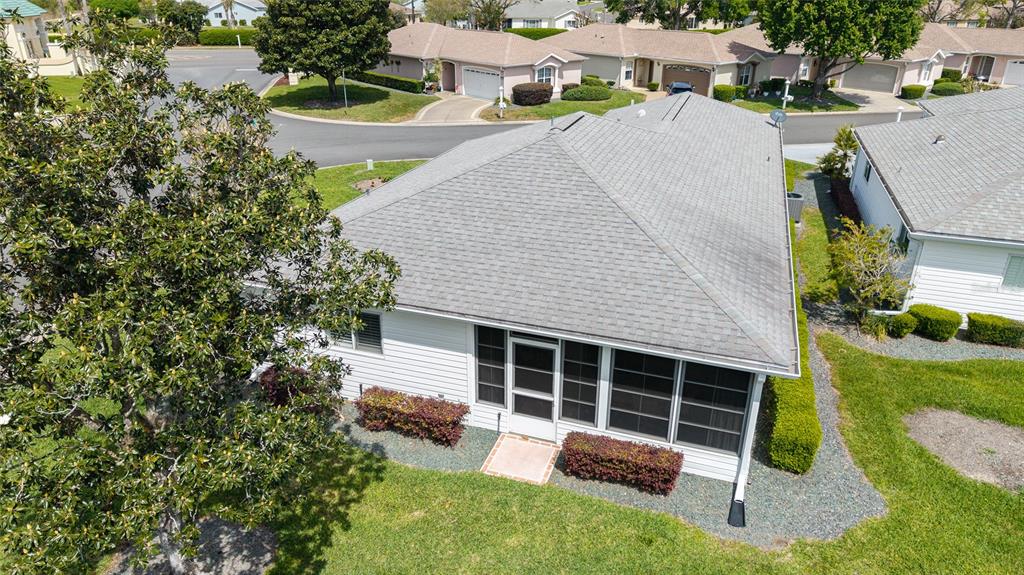 8608 Southeast 141st Street Road Summerfield, FL 34491 - Photo 60 of 82 a view of a house with backyard and sitting area