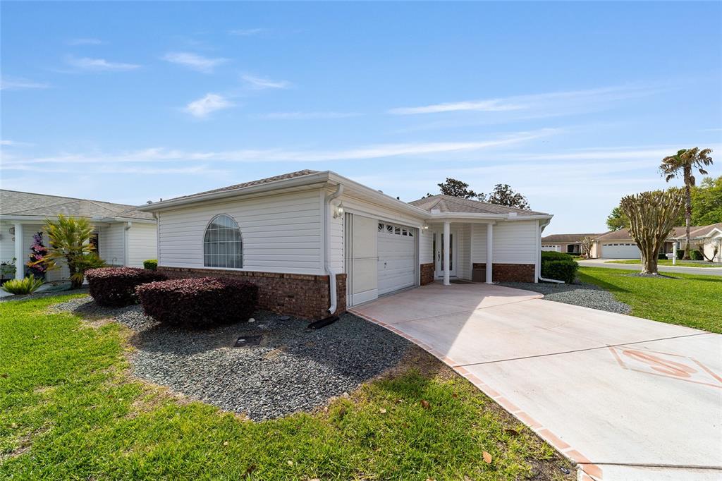 8608 Southeast 141st Street Road Summerfield, FL 34491 - Photo 63 of 82 a view of a house with backyard and sitting area